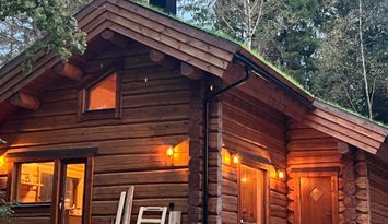 Modern log house in beautiful nature
