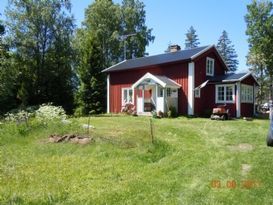 Nice little red house between two lakes.