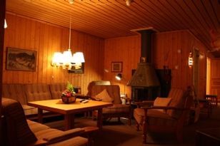 A large cozy log cabin with sauna and fireplace.