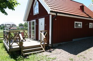 A red little cottage on the countryside in Sweden