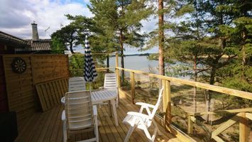 Lakeside timber cottage 30 metres from the sea