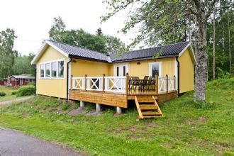 SOLSTUGAN med egen roddbåt