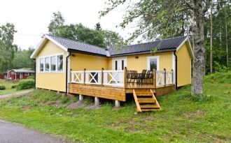 SOLSTUGAN med egen roddbåt