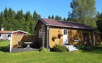 Liten stuga med uteplats