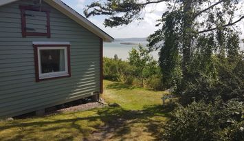 Mysig stuga med havsutsikt på Västkusten