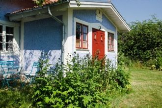 Stuga vid sjö med egen strand – bild 3 av 21