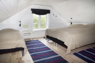 Stuga vid sjö med egen strand – bild 12 av 21