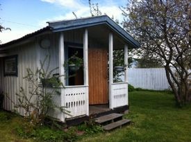 A cosy little cottage in a leafy garden