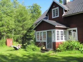 Typical Swedish House near lake and village