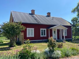 Charmigt hus på lantgård