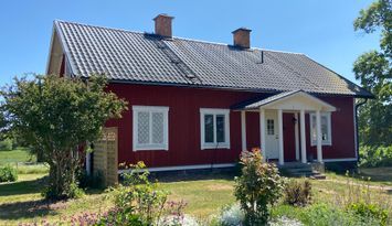 Charmigt hus på lantgård