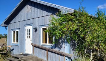 Stuga på ekologisk bondgård med djur