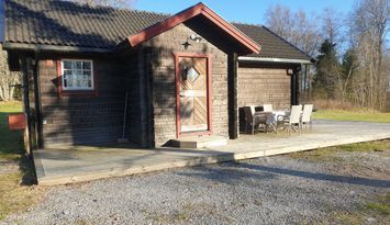 Timmerstuga i lantlig miljö