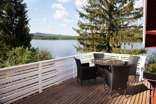 Ferienhaus mit Grundstück am See und Ruderboot