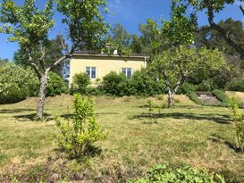 House located high, in village near forest/lake