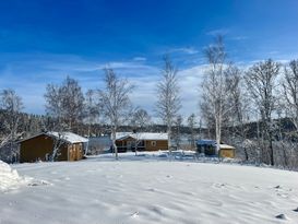 Typical Swedish cottage with stuga overlook a lake