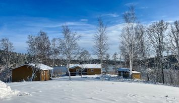 Typical Swedish cottage with stuga overlook a lake