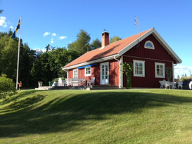 Red house located on a hill