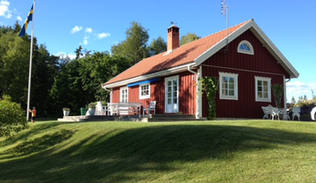 Red house located on a hill