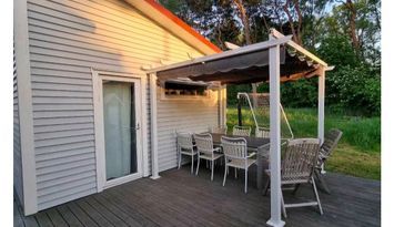 Gårdshus nära hav och strand