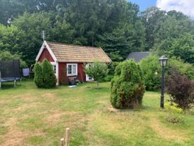 Small red guest house for rent in Vejbystrand