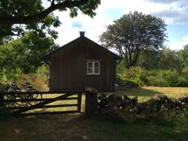 Feriehus i Särdal med trädgård och havsutsikt