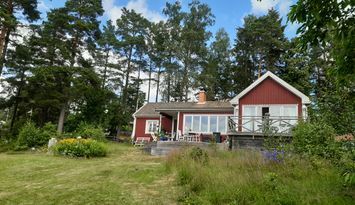 Hus med utsikt över havsvik, vissa veckor o dagar