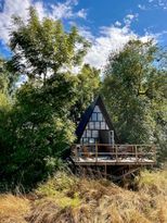 Unique A-frame houses nestled in greenery