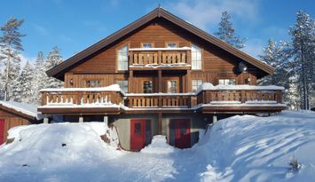 En sida av en modern parstuga i Tandådalen