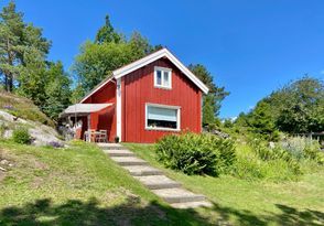 Red cottage with sea view