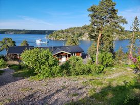 Egen sjötomt, bastu och roddbåt