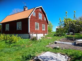 Red/white House in a Swedish cultural landscape