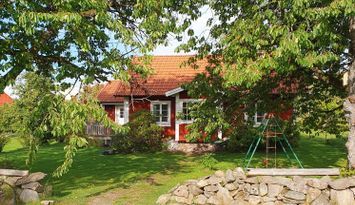 Hus på bondgård mitt i glasriket