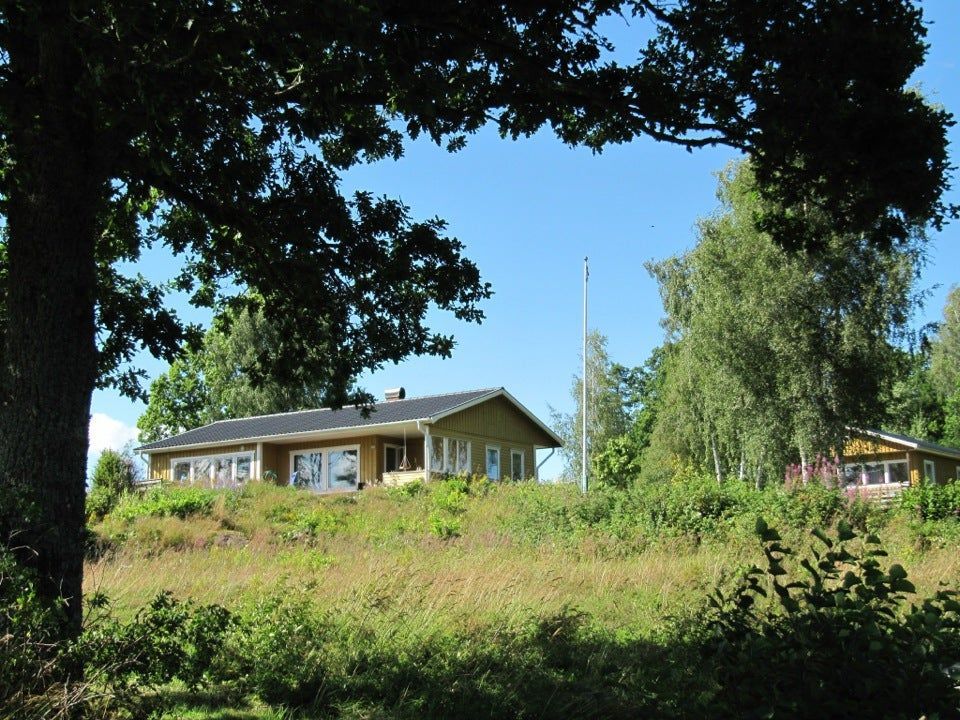 Typical Swedish cottage with stuga overlook a lake