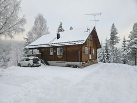 Älvutsikt Sälen, rustik brun stuga