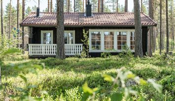 Rymlig 4p stuga med öppen spis i badort