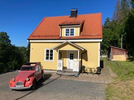 House near forest and lakes