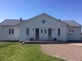 Newly built summer house in New England style in Skummeslöv