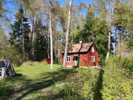 Small traditional cottage by the water